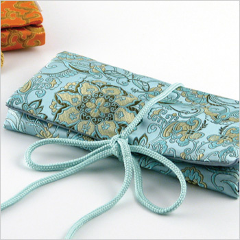 monogrammed brocade jewelry roll with 3 zippered compartments